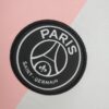 camiseta psg blanca y rosa escudo