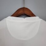 camiseta psg blanca y rosa cuello