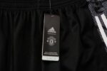 Pantalón de Chándal Manchester United 2122 etiqueta