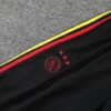 Logo 2 del pantalon de la tercena equipacion ajax bob marley