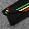 mangas del pantalon de la tercena equipacion ajax bob marley