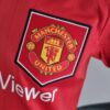 ESCUDO POLO Mini Conjunto Manchester United Primera Equipación 2022-2023