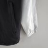 ACABADO LATERAL Cortavientos Nike Negro y Blanco