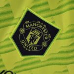 ESCUDO Tercera equipación Manchester United Mujer 2223