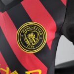 Conjunto niños Manchester City segunda equipación 22-23 - escudo