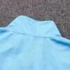 Dorso de la chaqueta del chándal celeste del Gremio FBPA 2022-2023