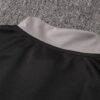 Dorso del cuello de la chaqueta del chándal negro de la Juventud 2022-2023