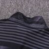 Dorso del cuello de la chaqueta del chándal negro del Manchester City 2022-2023