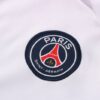 Escudo de la chaqueta del chándal blanco del Paris Saint-Germain 2022-2023