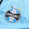 Escudo del chándal celeste del Gremio FBPA 2022-2023