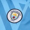 Escudo del chándal celeste del Manchester City 2022-2023