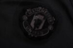 Escudo del chándal negro del Manchester United 2022-2023