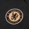 escudo de la chaqueta del chándal negro del Chelsea 2022-2023