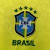 Camiseta local de Brasil mujer versión fan 22-23 escudo