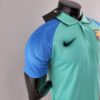 Polo FC Barcelona verde 2022-2023 lateral