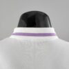 Polo Real Madrid blanco púrpura 2022-2023 dorso del cuello