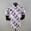 Polo Real Madrid blanco púrpura 2022-2023 frontal