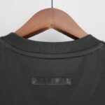 camiseta arsenal negra 2023 cuello anterior