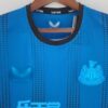 Camiseta Newcastle alternativa 2022-2023 cuello