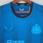 Camiseta Newcastle alternativa 2022-2023 cuello