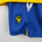 camiseta cádiz cf 2024 niño logo macron pantalón corto