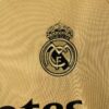 camiseta real madrid 2024 dorado escudo
