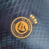 al nassr segunda equipacion escudo