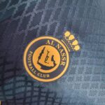 al nassr segunda equipacion escudo