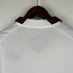 segunda equipacion manchester city 2024 cuello anterior