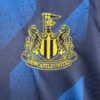 tercera equipacion newcastle escudo