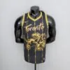 camiseta raptors negra y dorada
