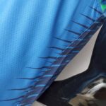 camiseta timberwolves celeste diseño lateral con rayas negras