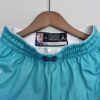 pantalon corto hornets azul cintura delantera celeste y etiqueta
