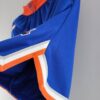 pantalon corto new york knicks azul contorno de la pierna con bordes naranja y blanco y plomo
