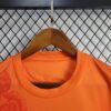 camiseta real madrid naranja cuello redondo