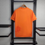 camiseta real madrid naranja espalda