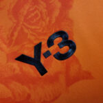 camiseta real madrid naranja logo