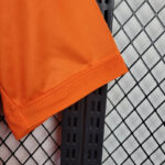 camiseta real madrid naranja manga