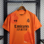 camiseta real madrid naranja pecho