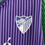 CAMISETA MALAGA SEGUNDA EQUIPACION FAN 23 24 ESCUDO