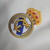 camiseta final champions real madrid escudo