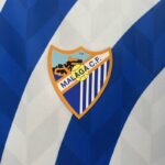 camiseta malaga 2025 escudo