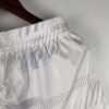 Pantalon-corto-primera-equipacion-Tottenham-2023-2024-pretina