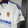Camiseta-real-zaragoza-primera-equipacion-2024-2025-puño-izquierdo
