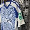 camiseta-granada-segunda-equipacion-2024-2025-puño-izquierdo