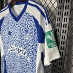 camiseta-granada-segunda-equipacion-2024-2025-puño-izquierdo