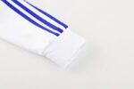 Chandal Real Madrid Blanco-Celeste 2024-2025 puño