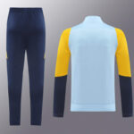 chandal-real-madrid-azul-blanco-2024-2025-parte-trasera