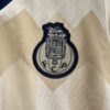 Conjunto Niño Porto Segunda Equipacion 2023-2024 escudo
