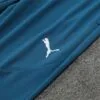 Chandal Olympique Masella Celeste 2024-2025 logo pantalon